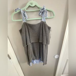 Gray knit off the shoulder sweater with mock button up detailing at bottom